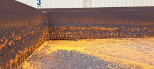 Total Corrosion Control for structural steel involves blasting off the rust and painting with epoxy paints.